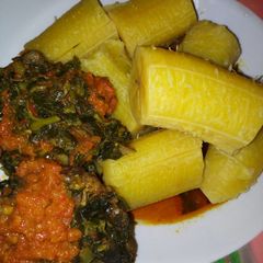 Ripe boiled plantain and vegetables with stew A picture of Ripe boiled plantain and vegetables with stew.