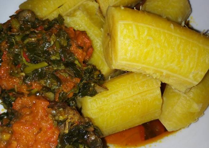 Ripe boiled plantain and vegetables with stew