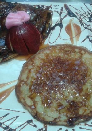 A picture of Eggless nutrella filled pancakes.