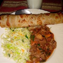Chapati served with beef and steamed cabbage A picture of Chapati served with beef and steamed cabbage.