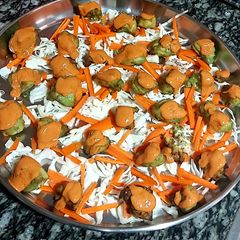 A picture of Grilled tikkas with tandoori sauce.