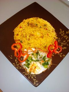 A picture of Stir fried rice with minced meat and sunny side up egg.