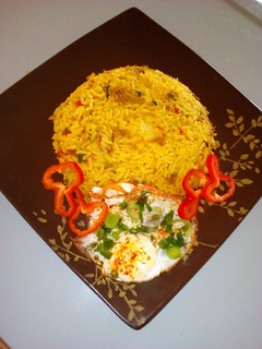 A picture of Stir fried rice with minced meat and sunny side up egg.