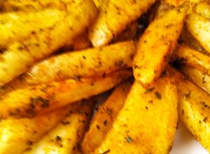 Foto principal de Gajos de patatas especiados, al horno