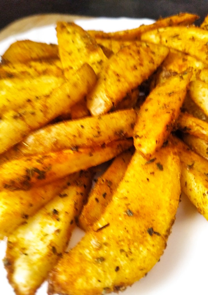 Una foto de Gajos de patatas especiados, al horno