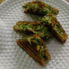 A picture of Cabbage Tri colour bell peppers Cheese Chilli Sandwich.