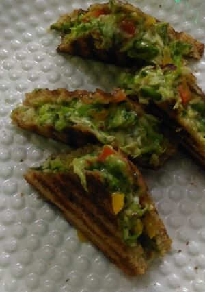 A picture of Cabbage Tri colour bell peppers Cheese Chilli Sandwich.