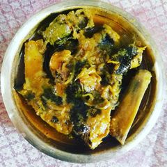 A picture of Fresh water catfish curry with raw banana.