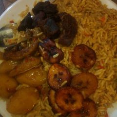 A picture of Jallof rice with plaintains and Irish.