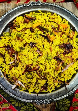 A picture of Quick Vegetable biryani with winter vegetables in cooker.