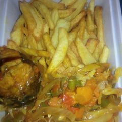 A picture of Chips and vegetable sauce with fish.