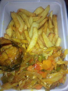A picture of Chips and vegetable sauce with fish.