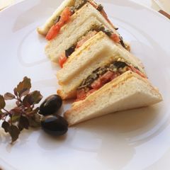 A picture of Black olives and Indian Basil Pesto Sandwich.