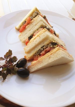 A picture of Black olives and Indian Basil Pesto Sandwich.