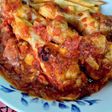Muslos de pollo en bolsa al horno en salsa de tomate confitado