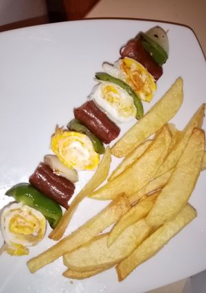 A picture of Potatoes and egg kebab.