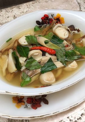 A picture of Clear Tom Yum Soup with Three Mushrooms (Vegetarian).
