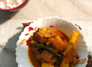A picture of Bengali Style Aloo Mutton Curry.