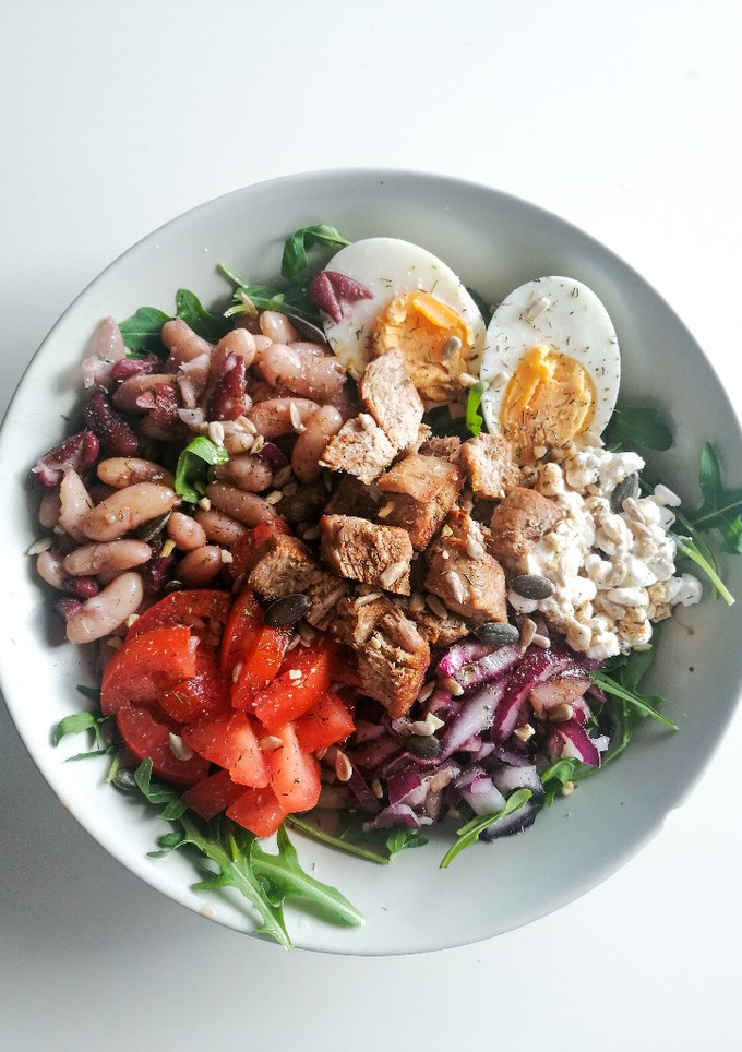 Una foto de Ensalada de rúcula y alubias