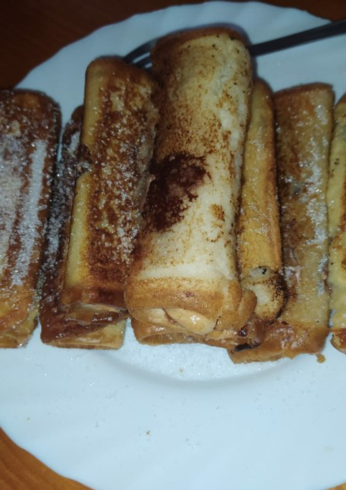 Una foto de Canutillos de torrija con Nutella