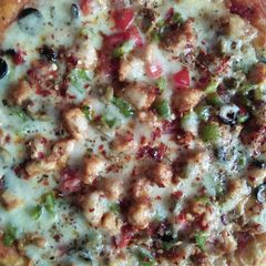 A picture of Chicken tikka pizza.