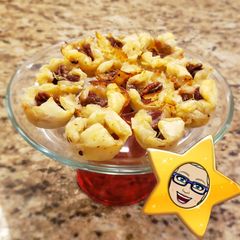 A picture of Festive Pecan-Cranberry 🧀 Brie Pastry Bites.