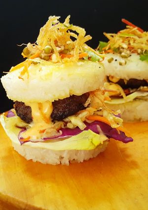 A picture of Japanise Sushi Burger with Mutton Kebab and Kimchi Salad.