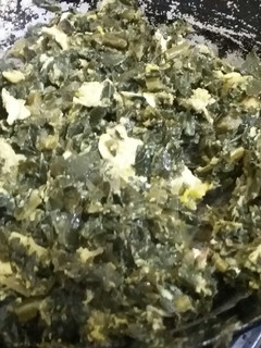 A picture of Eggs and kales.
