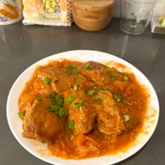 A picture of Pork-Stuffed Tofu with Tomato Sauce.