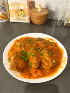 A picture of Pork-Stuffed Tofu with Tomato Sauce.