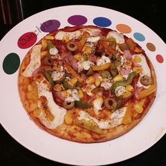 A picture of Homemade Farm house Pizza.