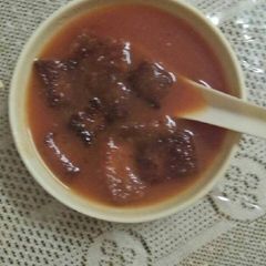 A picture of Tomato and carrot soup.