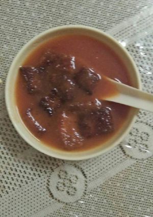 A picture of Tomato and carrot soup.