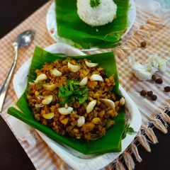 A picture of Fried garlic raw banana poriyal with rice.