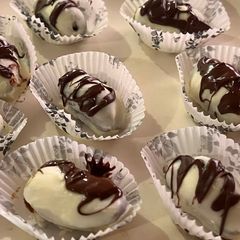 A picture of White chocolate covered dates.