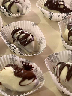A picture of White chocolate covered dates.