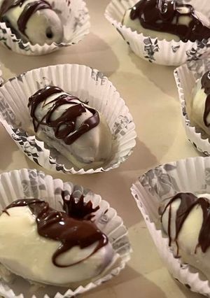A picture of White chocolate covered dates.