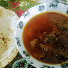 A picture of Beef qurma with naan.
