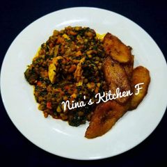 A picture of Garnished beans with fried plantain.
