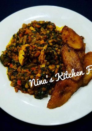 A picture of Garnished beans with fried plantain.