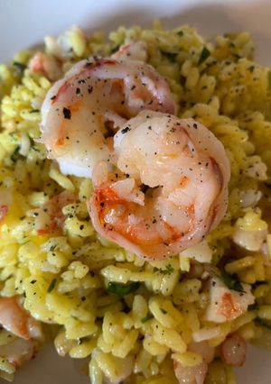 A picture of Chilled Saffron Risotto with Sautéed Zucchini and Shrimp.