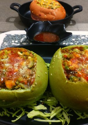 A picture of Pav filled with bhaji(pav,bhaji baked).