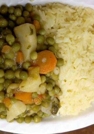 A picture of Tumeric Rice with peas stew.