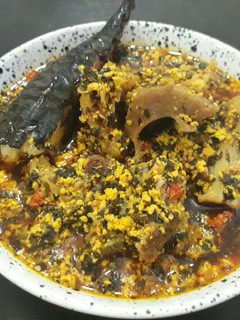 A picture of Egusi with bitterleaf soup.