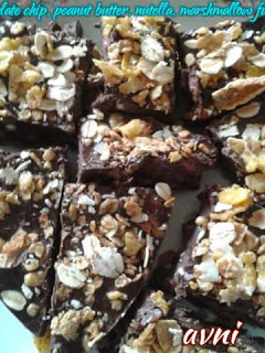 A picture of Chocolate chips, peanut butter, nutella and marshmallow fudge.