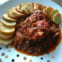 A picture of Grilled Fish in Garlic and Veggie Stew Paired with sweetPotatoes.