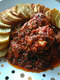 A picture of Grilled Fish in Garlic and Veggie Stew Paired with sweetPotatoes.