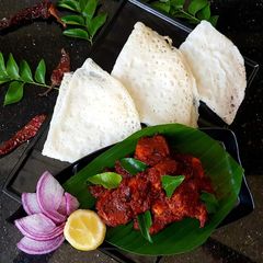 A picture of Neer Dosa & Prawn ghee roast.