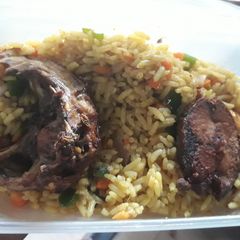 A picture of Grilled fish with fried rice.