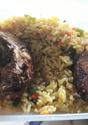 A picture of Grilled fish with fried rice.